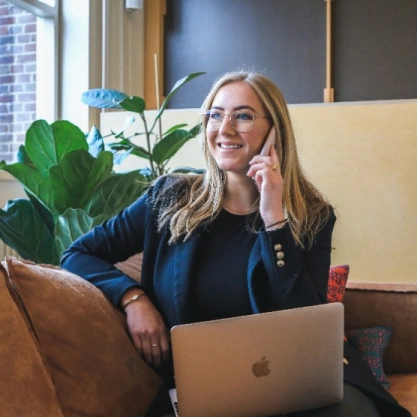 Woman on the phone working with professional attire