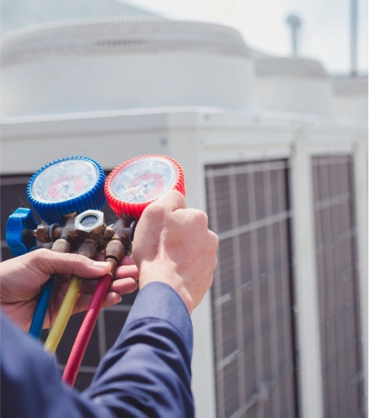 Service AC Worker adjusting dials ensuring correct functionality of product